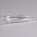 Clear plastic tongs with ridged ends sitting on top of each other.
