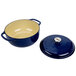 An indigo Lodge enameled cast iron dutch oven with a blue lid.