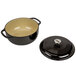A black and tan Lodge enameled cast iron pot with lid.