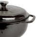 A black Lodge enameled cast iron dutch oven with a lid.