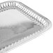 A silver rectangular fluted stainless steel tray with a design on it.