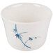 A white cup with blue bamboo design on it.