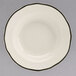 A white Homer Laughlin china bowl with a black scalloped rim.