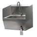 A stainless steel Advance Tabco hand sink with a faucet.