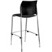 A National Public Seating black stackable bar stool with a padded seat and back and chrome legs.