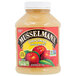 A plastic container of Musselman's Original Sweetened Applesauce.