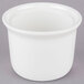 A close up of a white Tuxton Petite China Marmite Soup Crock with a lid.