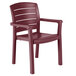 A pack of 4 red Grosfillex Acadia Bordeaux stacking resin armchairs.