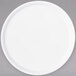 A white Carlisle melamine plate with a round rim on a gray surface.