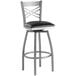 A Lancaster Table & Seating cross back swivel bar stool with a black cushion and silver frame.