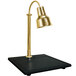 A Hanson brass carving lamp with a gold shade on a black synthetic granite base.