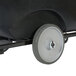 A close-up of a 10" heavy-duty tilt truck wheel on a black cart.