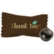 Individually wrapped black round "Thank You" chocolate buttermint.