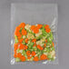 A VacPak-It Cook-In Retherm vacuum packaging bag filled with carrots and broccoli.