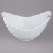 A white porcelain bowl with blue speckled specks and cut-out handles.