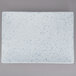A white rectangular porcelain platter with blue specks on the surface.