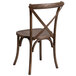 A Flash Furniture Early American wood chair with a cross back.