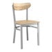 A Lancaster Table & Seating Boomerang Series chair with a driftwood seat and metal frame.