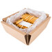 A white cardboard box filled with Dutch Country Foods soft pretzel sticks.