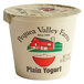 A white Pequea Valley Farm plain yogurt container with a red and white lid.