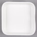 A white Arcoroc square porcelain bowl.
