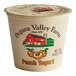 A white Pequea Valley Farm peach yogurt cup with a lid and label.