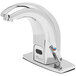A chrome T&amp;S ChekPoint hands-free sensor faucet with a water spout.