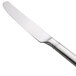 A Oneida Astragal stainless steel table knife with a silver handle.