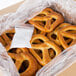 A box of Dutch Country Foods soft pretzels with a clear plastic bag of pretzels inside.