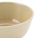 A beige bowl with speckled detailing.