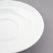 A white Arcoroc porcelain saucer with a small rim.