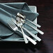 Oneida Rio 18/10 stainless steel salad/pastry fork on a plate.