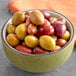 A bowl of Royal Ann Mediterranean olives with pits.