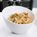 A white bowl of Regal Tricolor Rotini Pasta with vegetables.