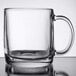 An Arcoroc clear tempered glass mug with a handle.