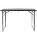 A Flash Furniture rectangular brown wood grain plastic folding table with legs.