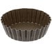 A brown fluted tart pan with a removable bottom.