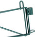 A green metal Metroseal 3 post-type wall mount shelf support with a metal hook.