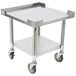 An APW Wyott stainless steel equipment stand with wheels and a shelf.