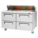 A stainless steel Turbo Air refrigerated sandwich prep table with 4 drawers.