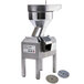 A Robot Coupe commercial food processor with a round metal bowl and two discs inside.