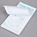 A Royal Paper Mexican Themed white guest check pad with writing on it.