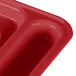 A close up of a red Cambro co-polymer compartment tray with 6 compartments.