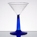 A clear plastic martini glass with a cobalt blue base.