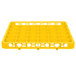 A yellow plastic shelf with 36 compartments and holes.