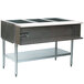 An Eagle Group stainless steel liquid propane steam table with a sealed well holding three pans on a counter.