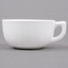 A Tuxton white china cappuccino cup with a handle.