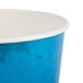 A Lavex blue and white disposable paper ice bucket with white lid.