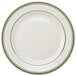 A white Tuxton china plate with green bands on the rim.