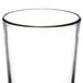 A close-up of a Libbey beverage glass with a black rim.